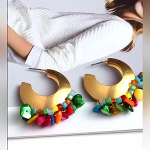 Gold plated earrings with coral beads.